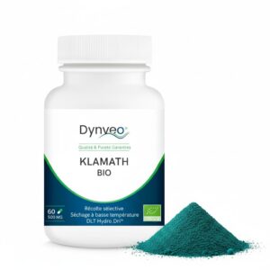 Bouteille de 60 gélules Dynveo KLAMATH BIO avec poudre d'algue turquoise à côté, sur fond blanc.