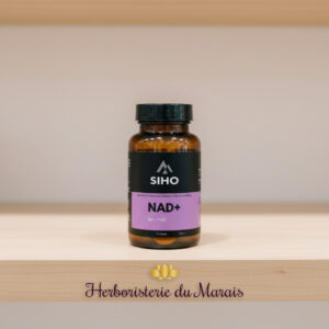 Capsules végétariennes translucides contenant des précurseurs NR et TMG dans un flacon ambré pour un protocole quotidien de vitalité cellulaire.